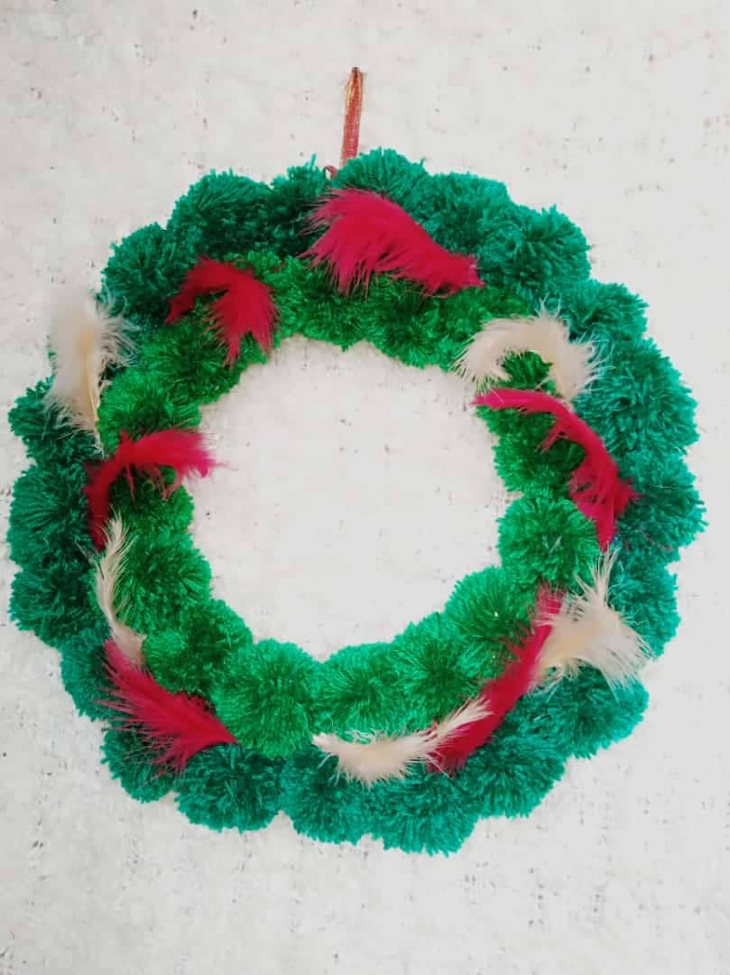 Green bubble Yarn with red and white feather