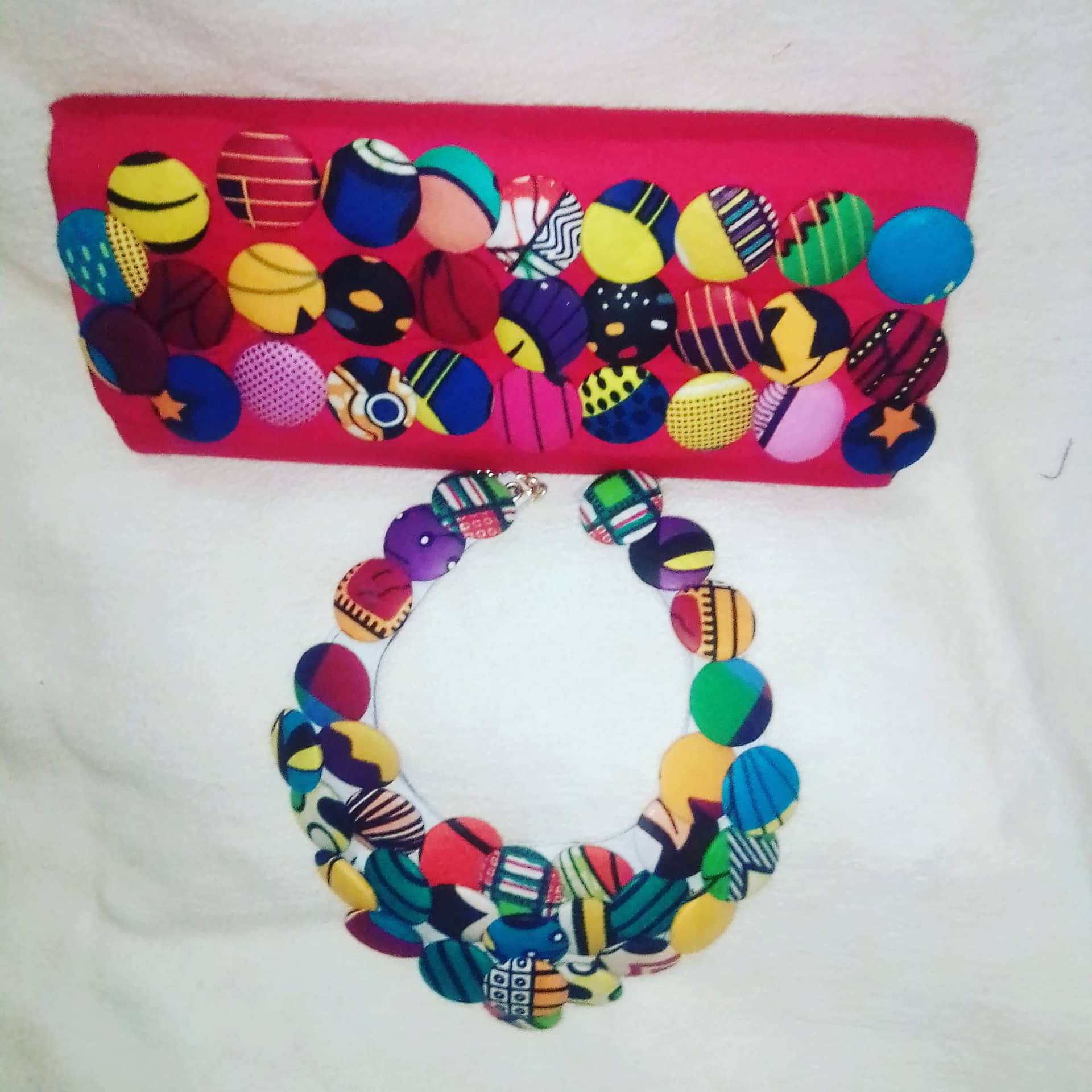 button clutch and necklace
